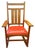 An absolutely pristine Stickley, Mission/Arts & Crafts style rocking chair. Solid cherry, wood frame, with milkweed-...
