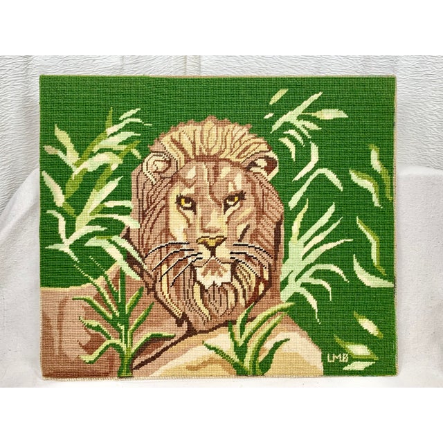 Striking vintage needlepoint. Features a handsome lion. Vibrant colors. Signed by the artist. Stretched finished canvas...