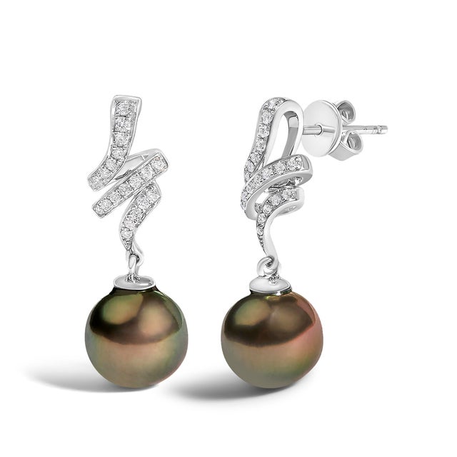 Imagine the graceful descent of twilight captured in an exquisite pair of earrings that combine luxury with a dramatic...