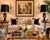 A striking pair of antique black amethyst glass table lamps in the Mary Gregory style, each featuring hand-enameled white...