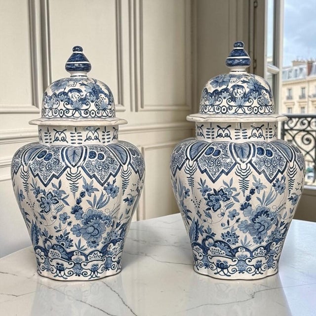 Grand pair of 19th century Dutch Delft covered vases, featuring ample proportions, beautifully rounded forms and matching...
