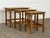This set of three nesting tables is by Henning Kjærnulf, produced in Denmark during the 1960s. Each table is topped in...