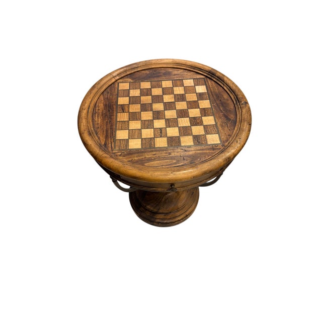 A beautifully handcrafted round game table that blends rustic charm with timeless functionality. The tabletop features an...