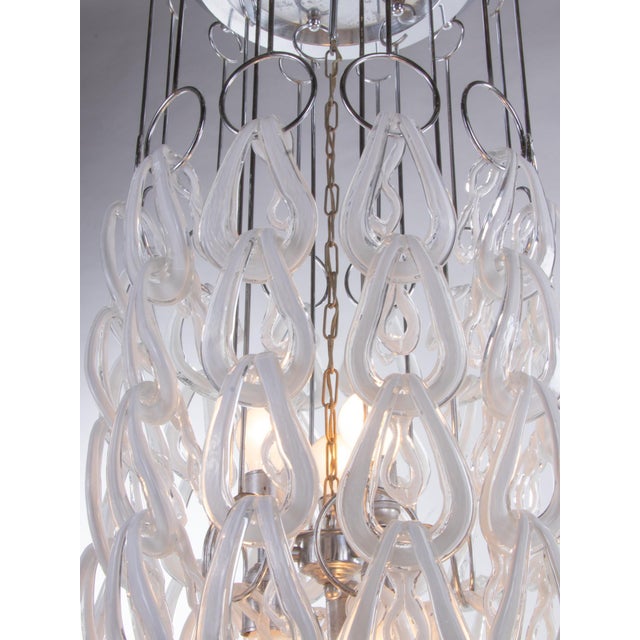 Imposing huge giogali chandelier with numerous interlaced clear-white murano glasses on a chrome frame. The elegant murano...