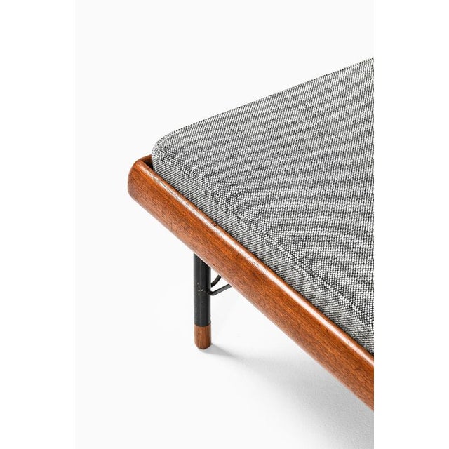This rare daybed, designed by erik buck and produced by knud juul-hansen in denmark in 1953, is a distinctive example of...