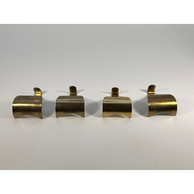 Set of 4 brass vintage brass picture rail hanging hooks from England.