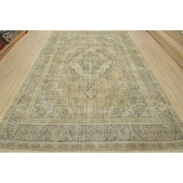 An authentic vintage traditional Tabriz rug hand-knotted with an all-wool pile on a cotton foundation. This oriental rug...