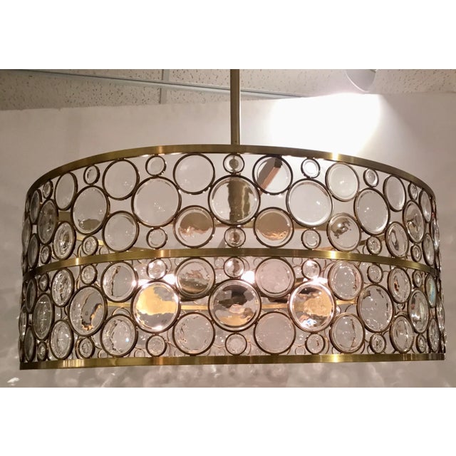 Original Retail $6760, chic Arteriors Modern Geometric Glass and Brass Round Tripoli Chandelier, Glas discs, brass finish,...