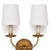 Updated opulence comes to mind with this double sconce, which wears an antique gold leaf finish on its ribbed backplate...