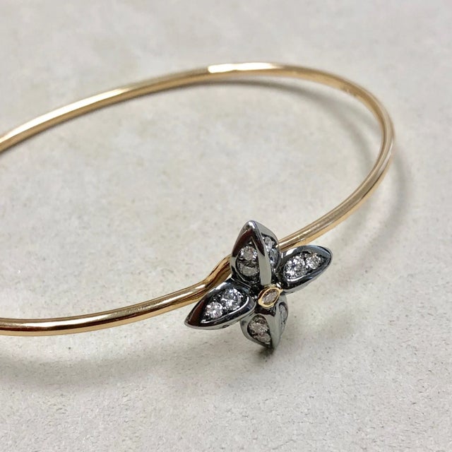 Created in 18 karat yellow gold & oxidized silver Diamonds 0.55 ct approx Openable oval bracelet Bracelet Inside wrap...