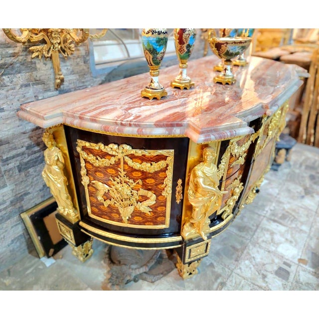 An extraordinary Empire-style sideboard cabinet that commands attention with its monumental scale, luxurious materials,...