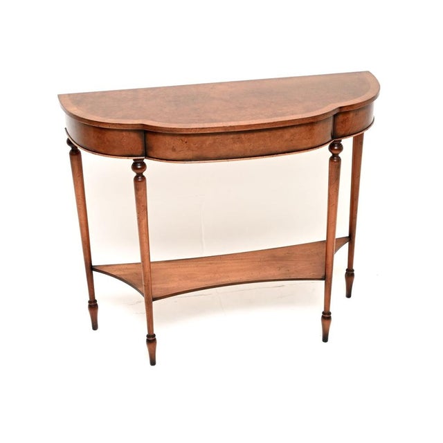 A beautiful and elegant antique Regency style burr walnut console table. This was made in England, it dates from around...