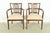 An exceptional pair of Mid-Century Modern spindle back armchairs or dining captain chairs In the manner of Paul McCobb...