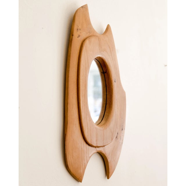 Mod biomorphic walnut shaped mirror, France circa 1960's.