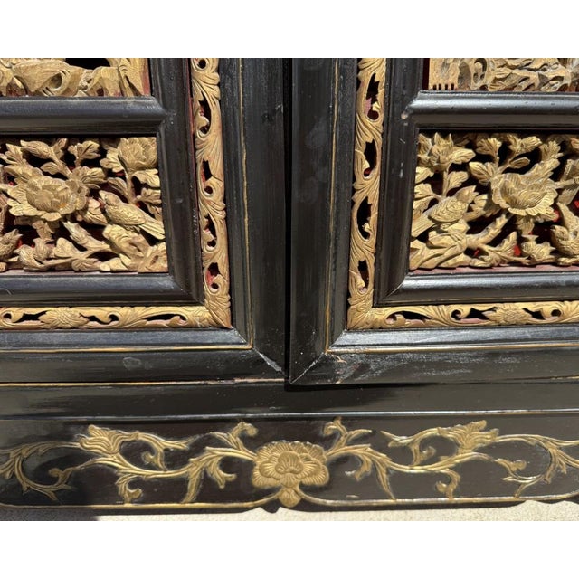 Late 20th Century Heavily Carved Black Asian Cabinet With Gold Doors and Red Interior For Sale - Image 12 of 13