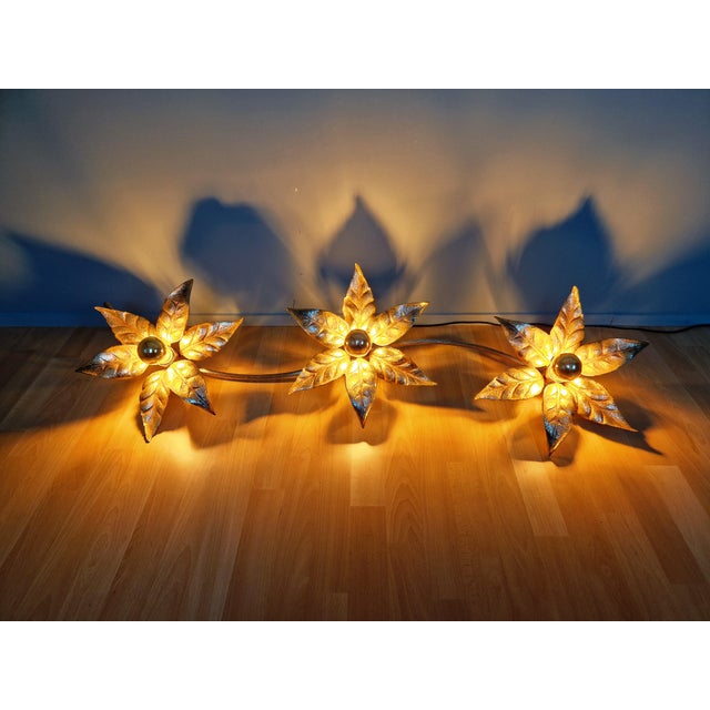 Large brass and gold-tone metal wall/ceiling light, composed of three flowers, designed by willy daro for massive...