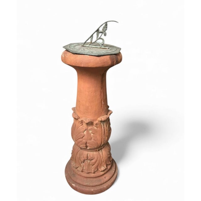 Enhance a garden path or patio with this charming vintage sundial. The piece features a warm, earthy terracotta pedestal...