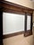 Empire -style fireplace mirror from early 1800s. In walnut wood, four black and black wooden columns, with three golden...