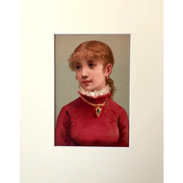 An original antique Victorian Era color chromolithograph print Portrait of a Girl with an emerald necklace. Presented...