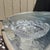 This piece is an antique clear glass handled nappy bowl from the McKee Glass Company Innovation line. Introduced around...