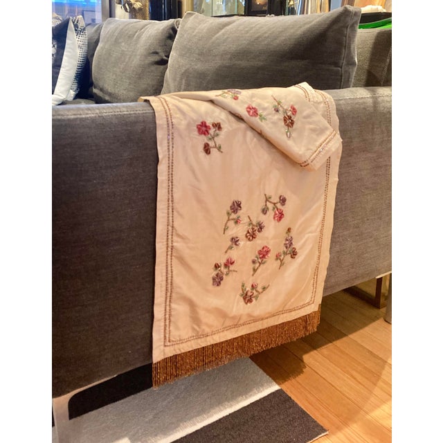 From Sethi & Sethi, add a touch of elegance to your home with this exquisite floral beaded embroidered silk throw....