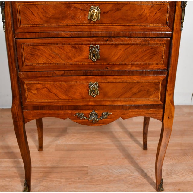 We are pleased to offer this beautiful Antique of French Louis XV Nightstand, from the 1900. This stand made of Walnut and...
