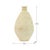 A graceful teardrop silhouette rises to a small flared neck in this Tamegroute vase, its surface left raw and unpolished...