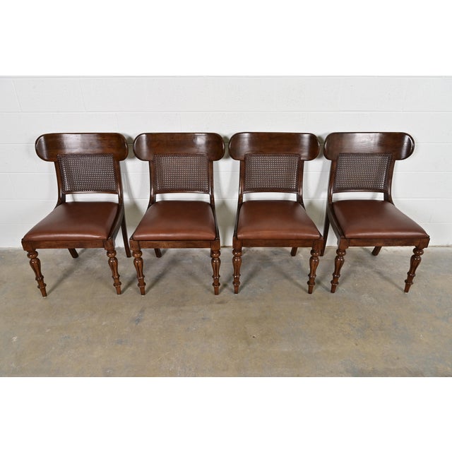 A gorgeous set of four English Regency style dining chairs By Ralph Lauren for Henredon Circa Late 20th Century Carved...