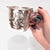 A fine signed antique American Art Nouveau shaving mug. By Unger Bros. In sterling silver. In the form of a mug with a...