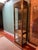 This is a rare vintage, Hollywood regency style brass and glass display vitrine cabinet likely made by Mastercraft. These...