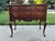 A Queen Anne style lowboy chest, no branding mark. Made in the USA in the mid-late 20th Century. Solid mahogany with brass...