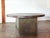 Round pedestal dining table with custom concrete top with steel banding, on a grey aniline dyed wood base. Beautiful...