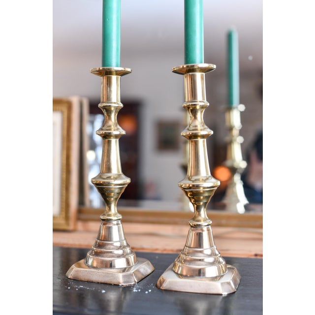 This is a beautiful pair of antique English brass beehive and traditional brass candlesticks with the wax push up inside....