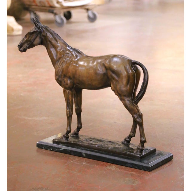This elegant antique bronze sculpture depicts a finely modeled horse standing at rest and is signed Christophe Fratin, one...