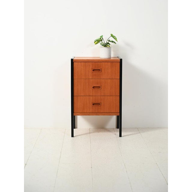 1960s chest of drawers produced by Bodafors, with the original branding, contrasting black profiles, and exposed brass...