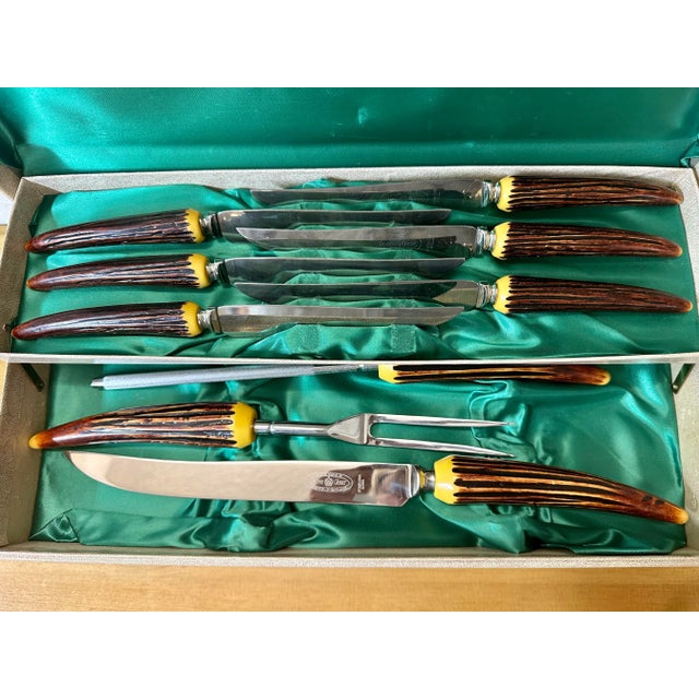 A delightful set of faux antler handles cutlery by Crown Crest, Sheffield England. Six steak knives, carving knife and...