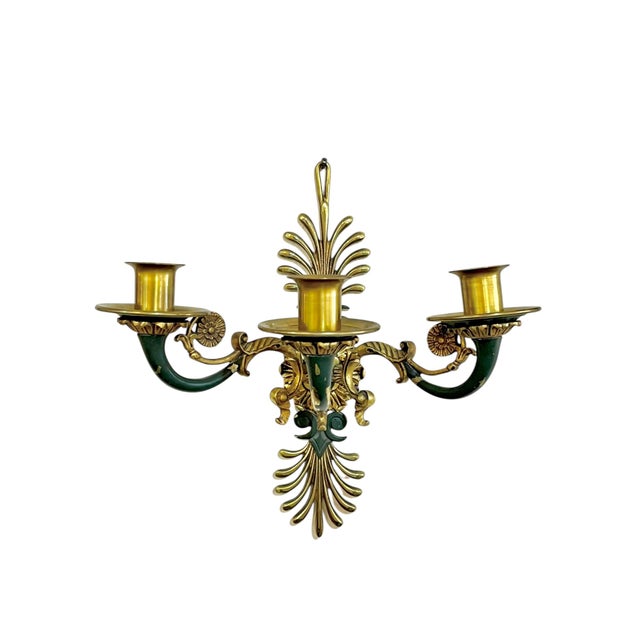An antique par of French Empire gilt bronze sconces with painted green accents. Lots of intricate detailing. Floral...