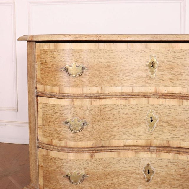 Interesting 18th C Austrian bleached oak serpentine commode. 1780 This piece is designed in the style of the selected...