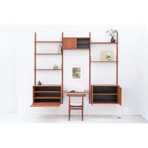 3-Bay teak wall unit, designed by Poul Cadovius and produced in his own Cado factory in Denmark, during the 1960’s. The...