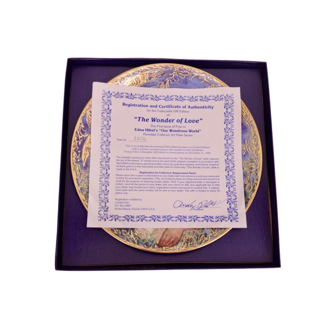 Hand Painted and gold encrusted decorative plate with a mother and child from the 1995 "Our Wondrous World" collection by...