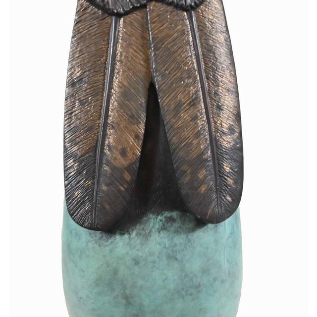 Striking bronze sculpture by Native American artist Ernest Eugene Bob Mirabal, professionally known as Cloud Eagle Cloud...