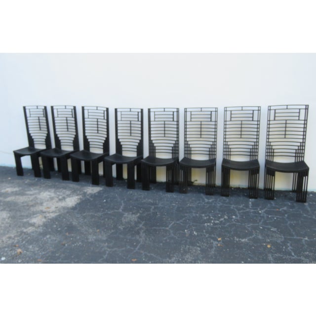 This unique Set of Eight Chairs is made out of wood. We believe the chairs were made by Miguel Rodrigo Mazure, due to...