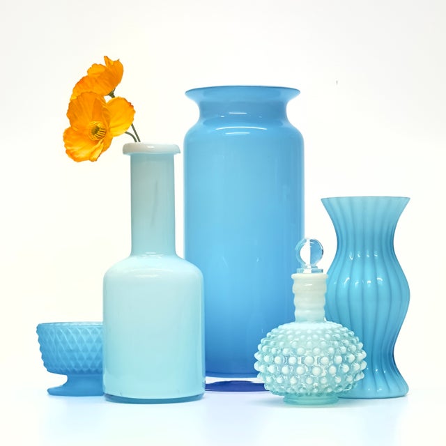 Assorted sky blue vessels, group of 5. A beautiful group of milky blue glass vessels of assorted shapes and sizes. A...