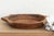 The sculptural form of this vintage bowl takes center stage. Carved from a single piece of solid hardwood, it features a...
