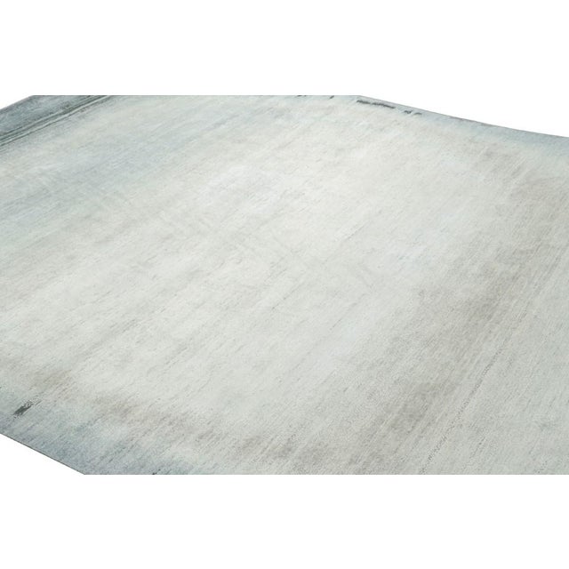 Made with hand-knotted wool and silk, this 9x12 contemporary rug is a rich new addition to Rug & Kilim’s Modern rug...