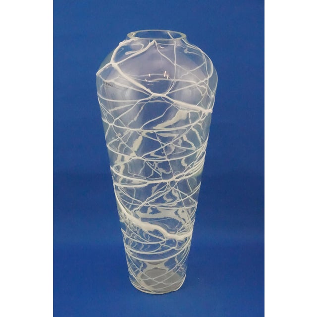 Large transparent blown glass vase from Murano, with white reticulated glass paste applications, creating a decorative web...