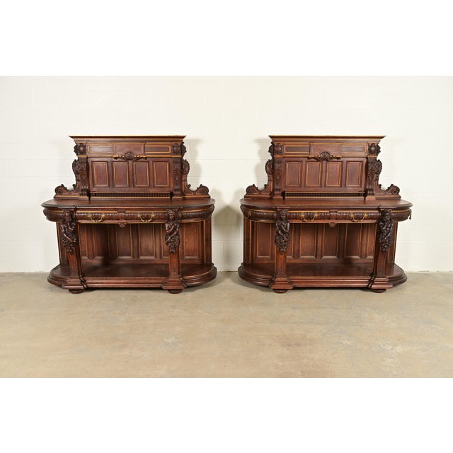 An exceptional pair of antique Victorian or Renaissance Revival sideboards, credenzas, or bar cabinets Attributed to R.J....