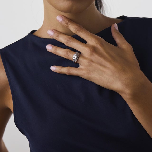 This beautiful Art Deco diamond engagement ring is a timeless 1930’s design, centered by a GIA-certified old mine cut...