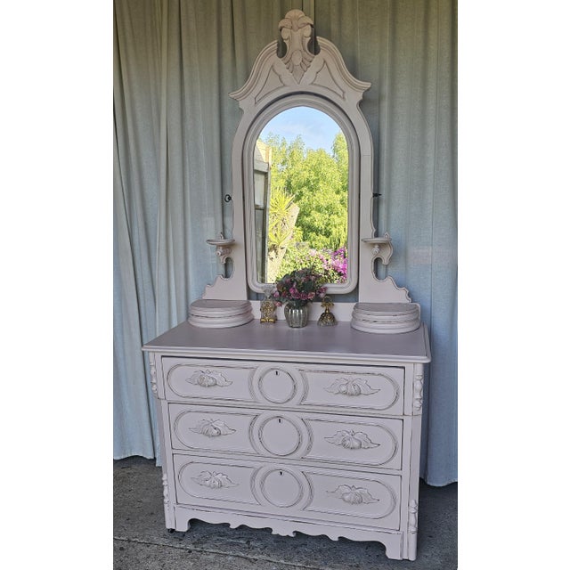 Offering for sale is This Gorgeous Victorian Dresser with Cheval Mirror with a perfect example of a Renaissance Revival...