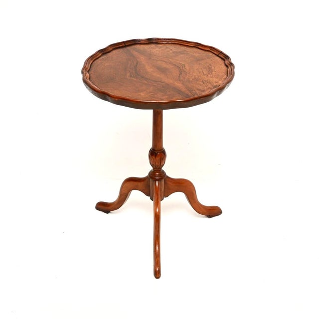 A beautiful antique figured walnut pie crust wine table. This was made in England, it dates from around the 1930’s period....